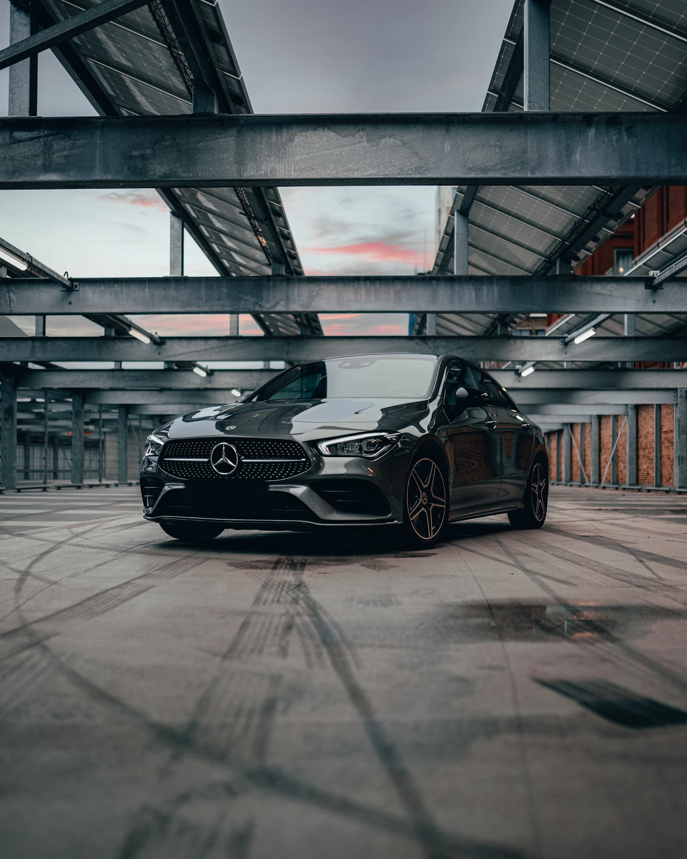 Dark executive sedan at dusk