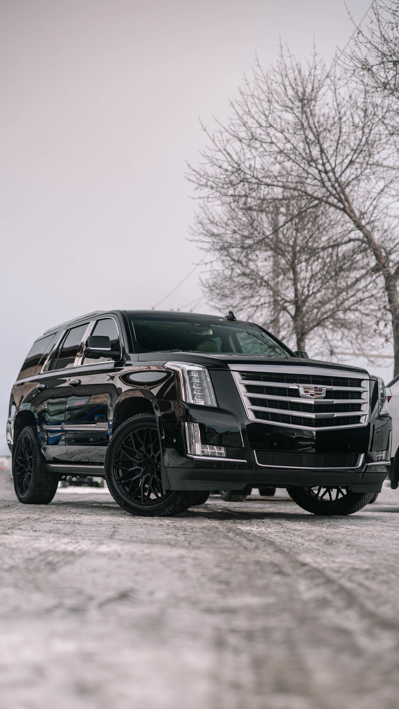 Black premium SUV, front three-quarter view
