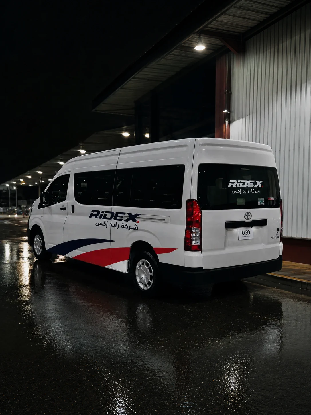 White Ride X Toyota HiAce van at a loading dock at night