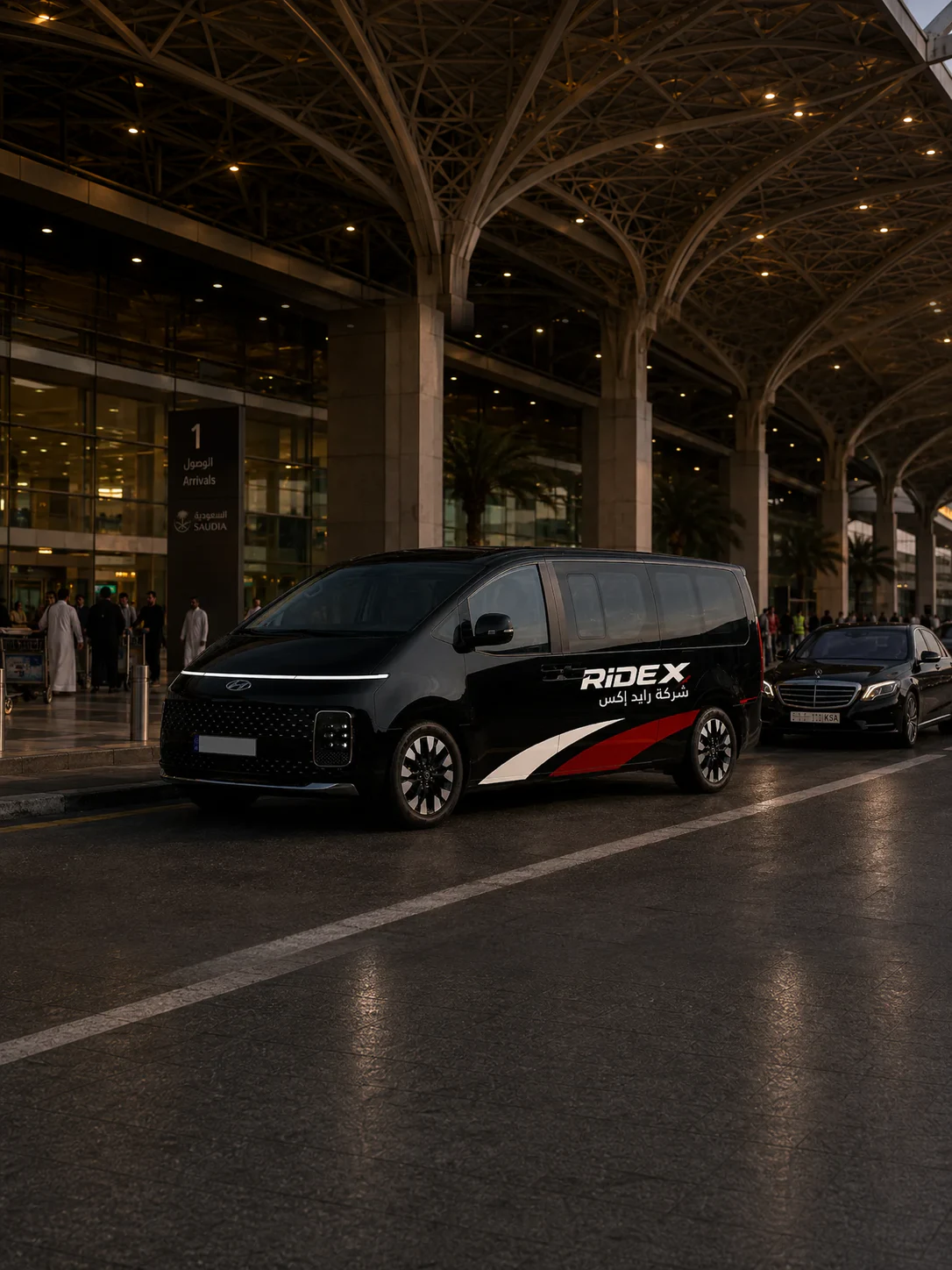 Black Ride X Hyundai Staria van at the airport arrivals hall